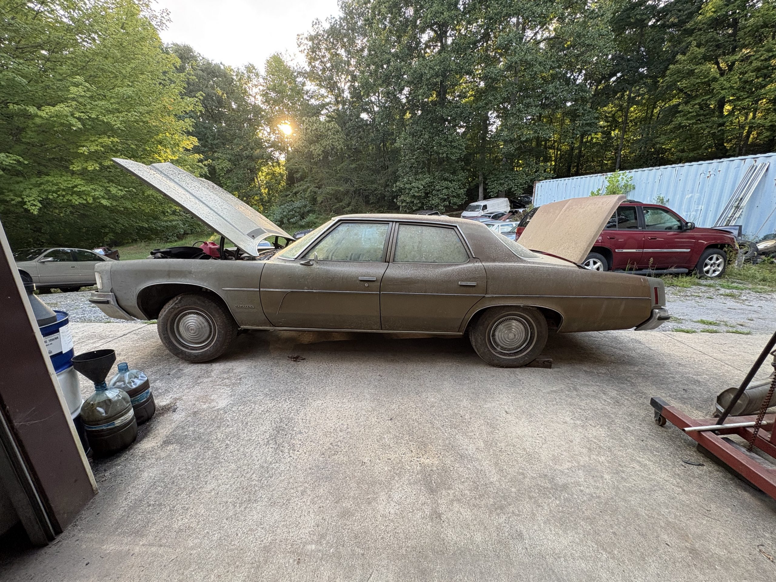 IMG_2272 1972 Pontiac Catalina parked outside the Rolling Start garage with the hood and trunk open, awaiting cleaning and evaluation.